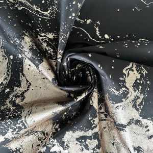 Jacquard with raised multicolored threads and gold accents